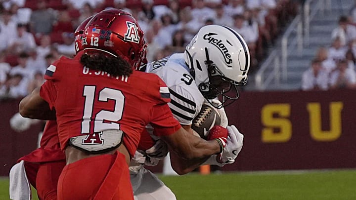 Iowa State Cyclones' wide receiver Brett Eskildsen (9) makes a catch around Arizona Wildcats defensive back Genesis Smith (12) during the second quarter in the Big-12 conference showdown on Sept. 27, 2025, at Jack Trice Stadium in Ames, Iowa.