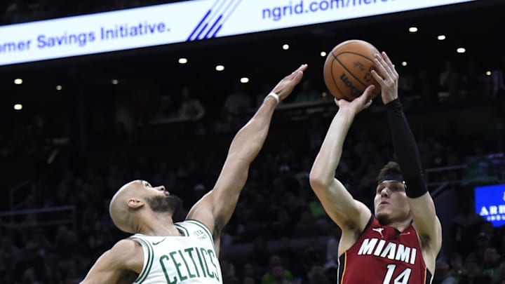 Apr 21, 2024; Boston, Massachusetts, USA; Miami Heat guard Tyler Herro (14) shoots the ball over Celtics guard Derrick White - Bob DeChiara/USA TODAY Sports Apr 21, 2024; Boston, Massachusetts, USA; Miami Heat guard Tyler Herro (14) shoots the ball over Celtics guard Derrick White - Bob DeChiara/USA TODAY Sports
