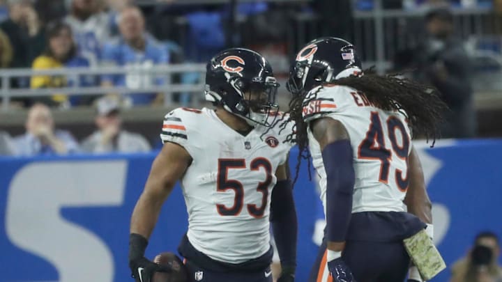 Chicago Bears linebackers T.J. Edwards (53) and Tremaine Edmunds (49) celebrate an interception of a pass intended for Detroit Lions receiver Donovan Peoples-Jones during the first half at Ford Field, Sunday, Nov. 19, 2023.