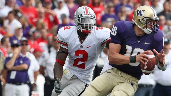(NCL_OSUWASH_LAURON 15SEP07) Jake Locker, # 10, Washington's quarterback, gives Ohio State's Malcolm Jenkins, 2, the slip in the first half of their game at Husky Stadium in Seattle, Washington, September 15, 2007. (Dispatch photo by Neal C. Lauron) (NCL_OSUWASH_LAURON 15SEP07) Jake Locker, # 10, Washington's quarterback, gives Ohio State's Malcolm Jenkins, 2, the slip in the first half of their game at Husky Stadium in Seattle, Washington, September 15, 2007. (Dispatch photo by Neal C. Lauron)