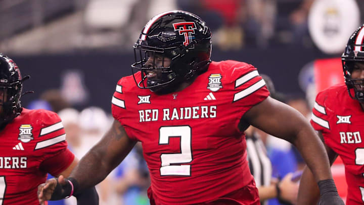 Texas Tech's Lee Hunter runs to the sideline after making a tackle against BYU