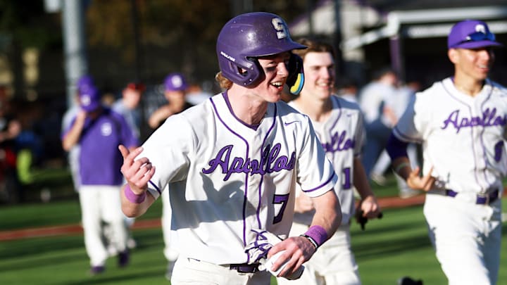 Sunset junior Luke Sullivan and his Apollos teammates are all smiles after the team’s 10-0 win over Southridge on Tuesday.