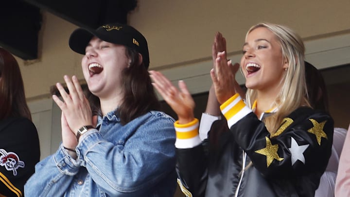 May 11, 2024; Pittsburgh, Pennsylvania, USA;  Louisiana State University gymnast Olivia Dunn (right) cheers as her boyfriend Pittsburgh Pirates starting pitcher Paul Skenes (not pictured) records a strikeout in his major league debut against the Chicago Cubs during the fourth inning at PNC Park. Mandatory Credit: Charles LeClaire-Imagn Images