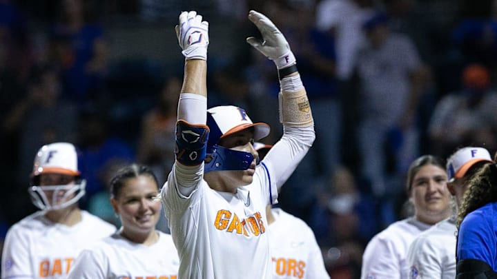 Skylar Wallace (17) tries to get the crowd excited after hitting her second home run of the night.