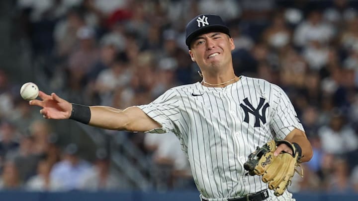 Aug 12, 2025; Bronx, New York, USA; New York Yankees shortstop Anthony Volpe (11) throws the ball first base for an out during the sixth inning at Yankee Stadium. Mandatory Credit: Vincent Carchietta-Imagn Images