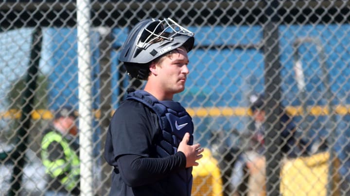 Tigers catcher Dillon Dingler works on throwing to the bases during spring training on Monday, Feb.