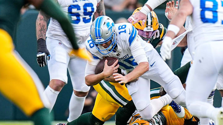 Detroit Lions quarterback Jared Goff is sacked by Green Bay Packers defensive ends Lukas Van Ness (90) and Rashan Gary (52) during the second half at Lambeau Field in Green Bay, Wis., on Sunday, September 7, 2025.