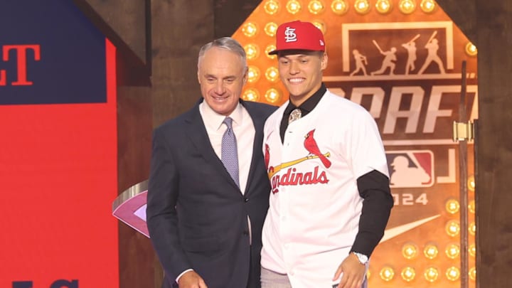 Jul 14, 2024; Ft. Worth, TX, USA;  JJ Wetherholt is congratulated by MLB commissioner Rob Manfred after being selected by the St. Louis Cardinals as the seventh player taken during the first round of the MLB Draft at Cowtown Coliseum. Mandatory Credit: Kevin Jairaj-Imagn Images