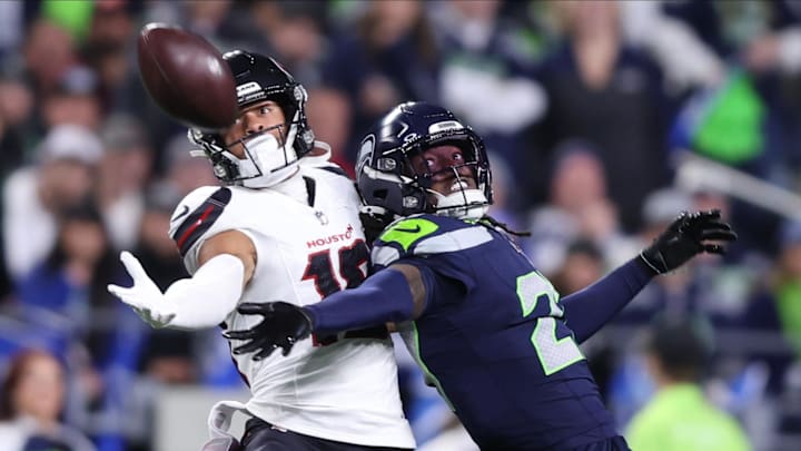 Oct 20, 2025; Seattle, Washington, USA; Seattle Seahawks cornerback Riq Woolen (27) defends a pass intended for Houston Texans wide receiver Xavier Hutchinson (19) during the fourth quarter at Lumen Field. Mandatory Credit: Kevin Ng-Imagn Images Oct 20, 2025; Seattle, Washington, USA; Seattle Seahawks cornerback Riq Woolen (27) defends a pass intended for Houston Texans wide receiver Xavier Hutchinson (19) during the fourth quarter at Lumen Field. Mandatory Credit: Kevin Ng-Imagn Images