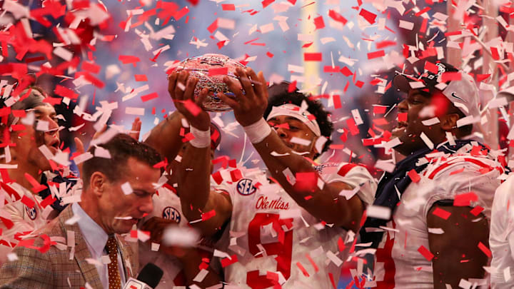 Dec 30, 2023; Atlanta, GA, USA; Mississippi Rebels wide receiver Tre Harris (9) holds up the Peach Bowl trophy after a victory against the Penn State Nittany Lions at Mercedes-Benz Stadium. Mandatory Credit: Brett Davis-USA TODAY Sports
Dec 30, 2023; Atlanta, GA, USA; Mississippi Rebels wide receiver Tre Harris (9) holds up the Peach Bowl trophy after a victory against the Penn State Nittany Lions at Mercedes-Benz Stadium. Mandatory Credit: Brett Davis-USA TODAY Sports