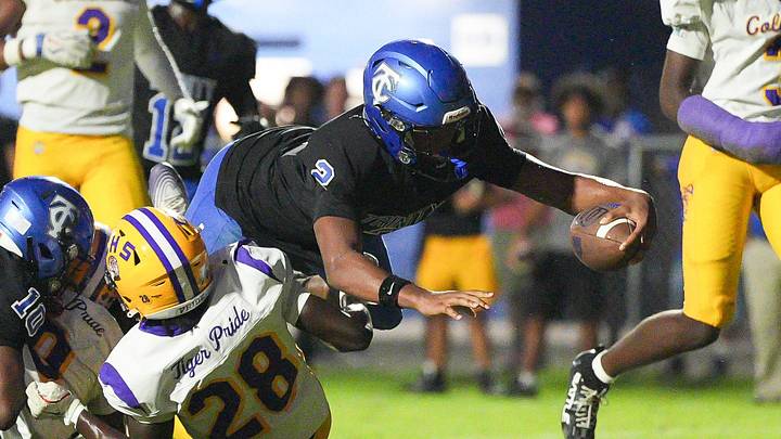 Trinity Christian quarterback Terel Dallas (2) dives into the end zone for a touchdown in the second quarter. The Trinity Christian Conquerors hosted the Columbia Tigers Friday, September 18, 2026 in Jacksonville, Fla. Columbia won 27-20. [ Doug Engle/Florida Times-Union]