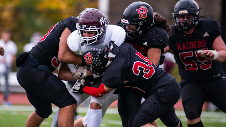 Port Jervis defenders sack a New Paltz player during the Section 9 class B football championship football game at James I O'Neill High School in Highland Falls, NY on Friday, November 11, 2022. Port Jervis defeated New Paltz 34-7. KELLY MARSH/FOR THE TIMES HERALD-RECORD

Ekmclassbfb40