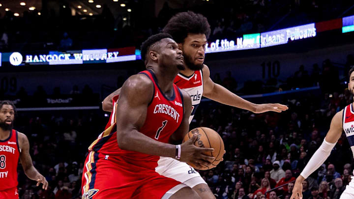 Feb 14, 2024; New Orleans, Louisiana, USA;  New Orleans Pelicans forward Zion Williamson (1) dribbles against Washington Wizards forward Marvin Bagley III (35) during the second half at Smoothie King Center. Mandatory Credit: Stephen Lew-Imagn Images