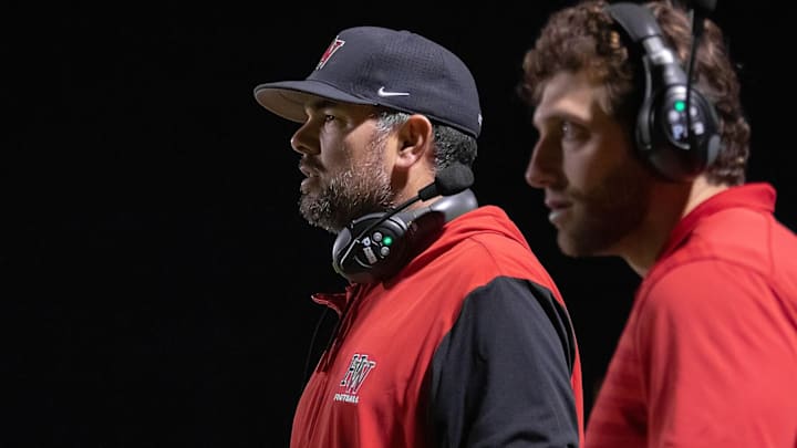 Aaron Huerta (left) is the new head football coach at Bishop Alemany High.