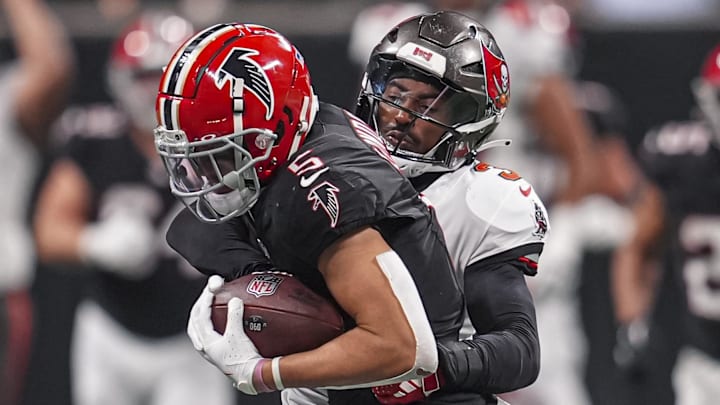 Atlanta Falcons wide receiver Drake London is tackled by Tampa Bay Buccaneers safety Jordan Whitehead. Atlanta Falcons wide receiver Drake London is tackled by Tampa Bay Buccaneers safety Jordan Whitehead.