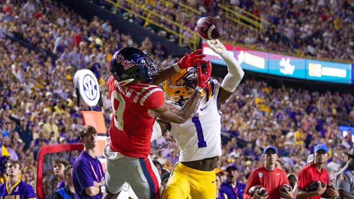 Oct 12, 2024; Baton Rouge, Louisiana, USA;  LSU Tigers cornerback Ashton Stamps (1) blocks a pass intended for Mississippi Rebels wide receiver Tre Harris (9) during the second half at Tiger Stadium. Mandatory Credit: Stephen Lew-Imagn Images
