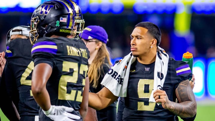 Jacob Manu works the sideline as he sits out against Rutgers. 