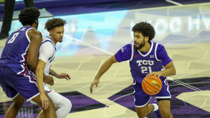 Noah Reynolds dribbles off an Ernest Udeh Jr. screen for TCU men's basketball against Kansas on January 22, 2025. Noah Reynolds dribbles off an Ernest Udeh Jr. screen for TCU men's basketball against Kansas on January 22, 2025.