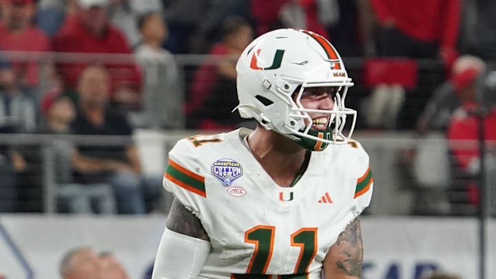 Dec 31, 2025; Arlington, TX, USA; Miami Hurricanes quarterback Carson Beck (11) reads after a Miami touchdown against the Ohio State Buckeyes during second half the 2025 Cotton Bowl and quarterfinal game of the College Football Playoff at AT&T Stadium. Mandatory Credit: Raymond Carlin III-Imagn Images