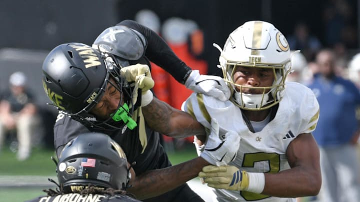 Sep 27, 2025; Winston-Salem, North Carolina, USA; Wake Forest Demon Deacons wide receiver Micah Mays Jr. (7) takes a hit from Georgia Tech Yellow Jackets defensive back Ahmari Harvey (3) during the third quarter at Allegacy Federal Credit Union Stadium. Mandatory Credit: Zachary Taft-Imagn Images Sep 27, 2025; Winston-Salem, North Carolina, USA; Wake Forest Demon Deacons wide receiver Micah Mays Jr. (7) takes a hit from Georgia Tech Yellow Jackets defensive back Ahmari Harvey (3) during the third quarter at Allegacy Federal Credit Union Stadium. Mandatory Credit: Zachary Taft-Imagn Images