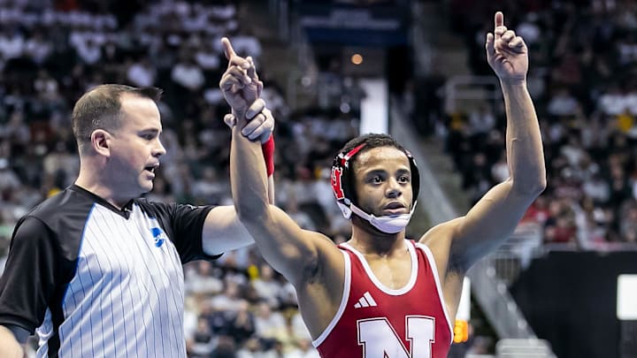 Mar 21, 2024; Kansas City, MO, USA; Caleb Smith of Nebraska defeats Michael DeAugustino of Michigan during the Men’s Division I NCAA Wrestling Championships at T-Mobile Center. 