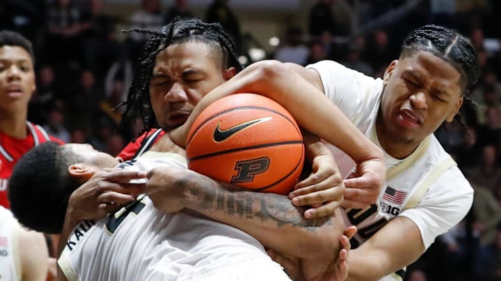 Rutgers center Lathan Sommerville, behind the ball, battles Purdue's  Trey Kaufman-Renn (4) and Gicarri Harris (24) for a rebound.
