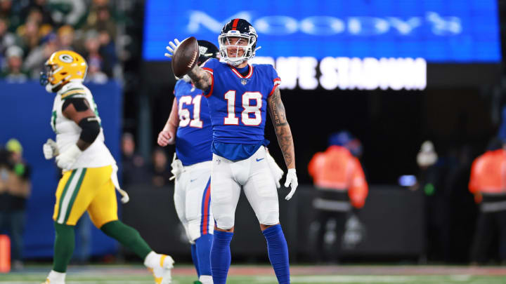 Dec 11, 2023; East Rutherford, New Jersey, USA; New York Giants wide receiver Isaiah Hodgins (18) reacts during the second quarter against the Green Bay Packers at MetLife Stadium. 