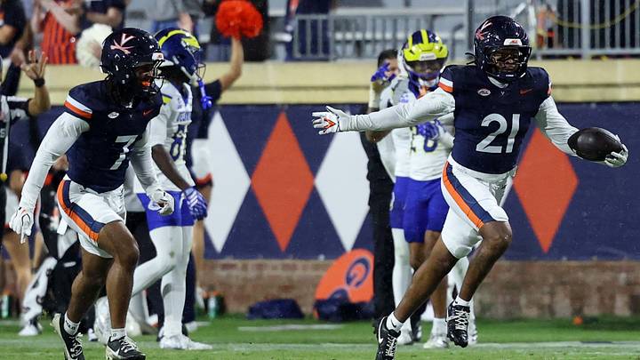Sep 26, 2026; Charlottesville, Virginia, USA; Virginia Cavaliers safety Keke Adams (21) celebrates after intercepting a pass against the Delaware Blue Hens during the second half at Scott Stadium. Mandatory Credit: Geoff Burke-Imagn Images Sep 26, 2026; Charlottesville, Virginia, USA; Virginia Cavaliers safety Keke Adams (21) celebrates after intercepting a pass against the Delaware Blue Hens during the second half at Scott Stadium. Mandatory Credit: Geoff Burke-Imagn Images