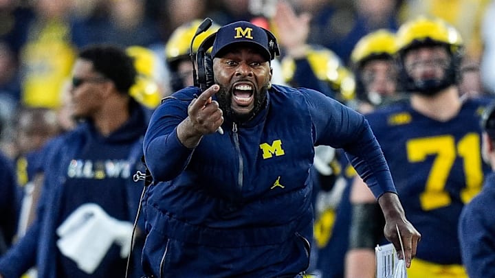 Michigan head coach Sherrone Moore challenges an incomplete pass intended for tight end Colston Loveland (not pictured) during the second half against Oregon at Michigan Stadium in Ann Arbor on Saturday, Nov. 2, 2024. Moore lost the challenge.