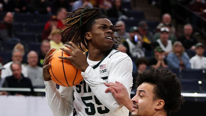 Mar 14, 2024; Minneapolis, MN, USA; Michigan State Spartans forward Coen Carr (55) charges into Minnesota Golden Gophers guard Braeden Carrington (4) during the first half at Target Center. Mandatory Credit: Matt Krohn-USA TODAY Sports