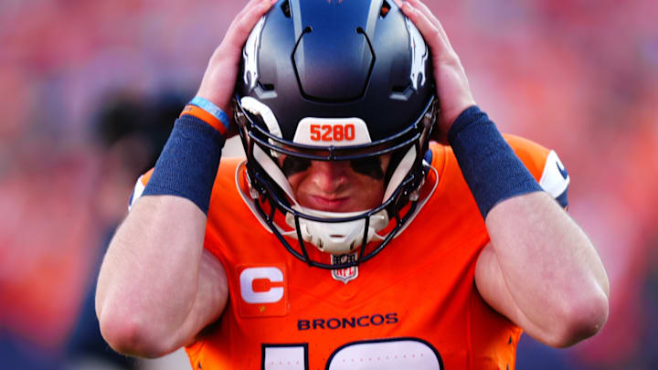Dec 15, 2024; Denver, Colorado, USA; Denver Broncos quarterback Bo Nix (10) reacts during the first quarter against the Indianapolis Colts at Empower Field at Mile High. 