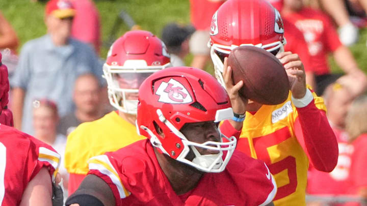 Jul 22, 2024; St. Joseph, MO, USA; Kansas City Chiefs guard Trey Smith (65) blocks on the line during training camp at Missouri Western State University. Mandatory Credit: Denny Medley-Imagn Images