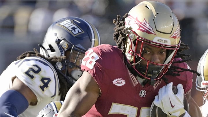 Nov 23, 2024; Tallahassee, Florida, USA; Florida State Seminoles running back Samuel Singleton Jr. (28) runs the ball against the Charleston Southern Buccaneers at Doak S. Campbell Stadium. Mandatory Credit: Melina Myers-Imagn Images Nov 23, 2024; Tallahassee, Florida, USA; Florida State Seminoles running back Samuel Singleton Jr. (28) runs the ball against the Charleston Southern Buccaneers at Doak S. Campbell Stadium. Mandatory Credit: Melina Myers-Imagn Images