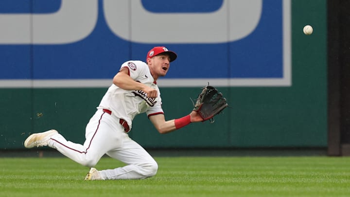Sep 16, 2025; Washington, District of Columbia, USA; Washington Nationals outfielder Jacob Young (30) makes a catch on a line drive hit by Atlanta Braves outfielder Eli White (not pictured) during the eighth inning at Nationals Park. Sep 16, 2025; Washington, District of Columbia, USA; Washington Nationals outfielder Jacob Young (30) makes a catch on a line drive hit by Atlanta Braves outfielder Eli White (not pictured) during the eighth inning at Nationals Park.