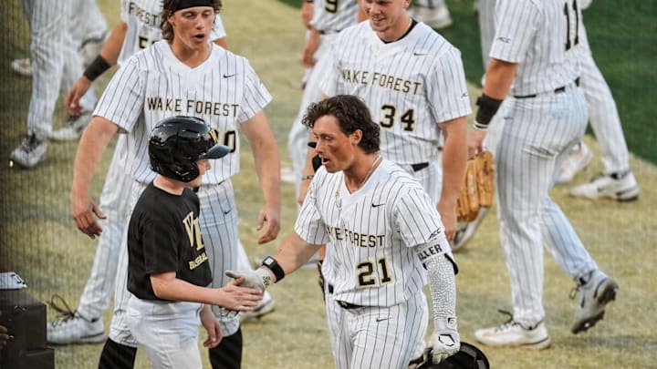 Wake Forest Infielder Jackson Miller celebrates with his teammates in the win over Coastal Carolina on April 14.