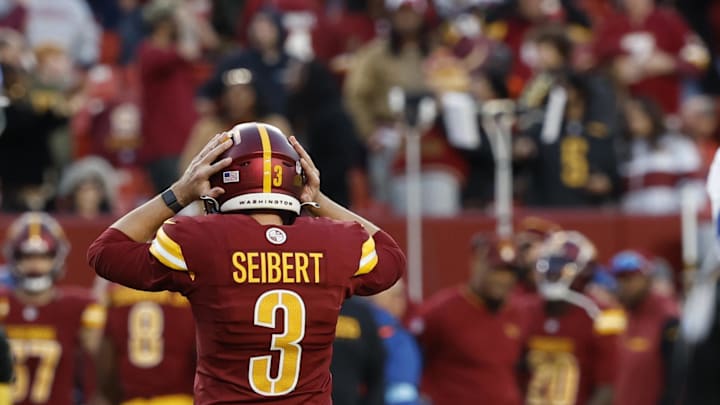 Nov 24, 2024; Landover, Maryland, USA; Washington Commanders place kicker Austin Seibert (3) reacts after missing a potential game-tying extra point in the final minute against the Dallas Cowboys during the fourth quarter at Northwest Stadium. Mandatory Credit: Geoff Burke-Imagn Images