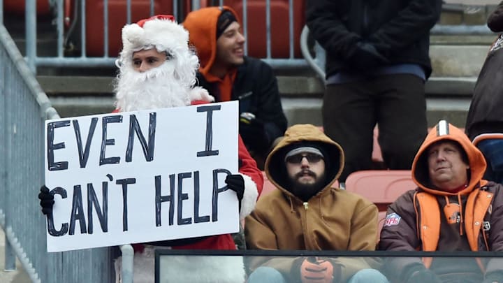 Dec 17, 2017; Cleveland, OH, USA; A Cleveland Browns fan dressed as Santa Claus holds a sign during the game between the Cleveland Browns and the Baltimore Ravens during the second half at FirstEnergy Stadium. Mandatory Credit: Ken Blaze-Imagn Images
