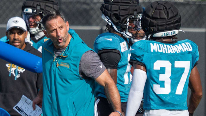Jacksonville Jaguars Defensive Coordinator Anthony Campanile talks to Jacksonville Jaguars cornerback Jabbar Muhammad (37) after he fumbled the ball during the Jaguars 14th NFL training camp session at Miller Electric Center Tuesday August 12, 2025 in Jacksonville, Fla. The Jaguars travel to New Orleans to play the Saints this Sunday in their second preseason game. [Doug Engle/Florida Times-Union]