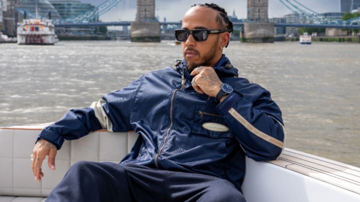 Lewis Hamilton in a boat with an IWC watch