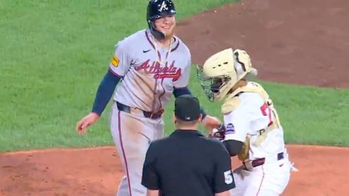 Alex Verdugo laughs off a very not close play at home. 