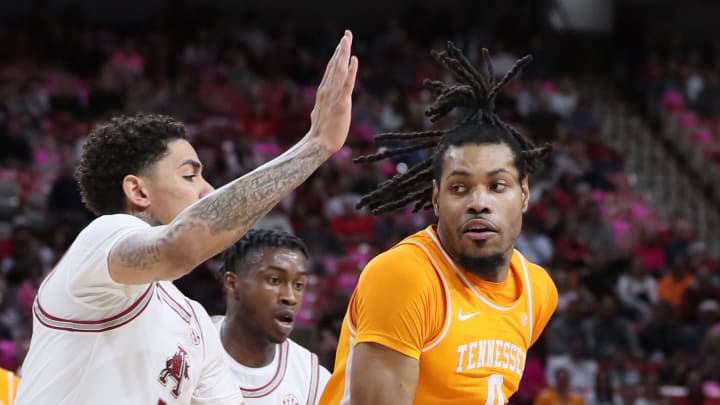 Feb 14, 2024; Fayetteville, Arkansas, USA; Tennessee Volunteers forward Jonas Aidoo (0) drives against Arkansas forward Jalen Graham