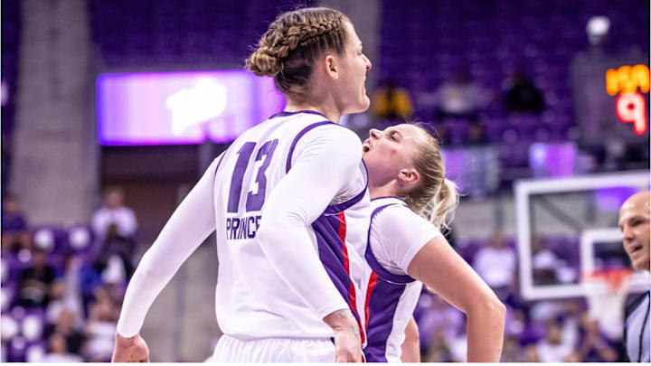 Sedona Prince and Hailey Van Lith celebrate during a game. Sedona Prince and Hailey Van Lith celebrate during a game.
