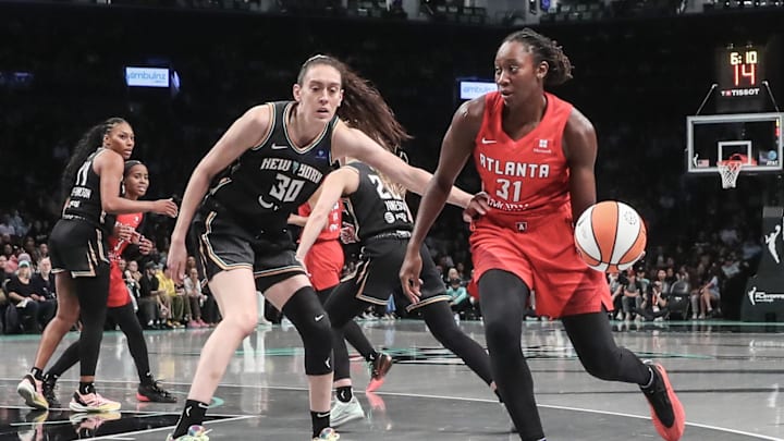 Atlanta Dream center Charles looks to drive past New York Liberty forward Stewart during game two of the first round of the 2024 WNBA Playoffs at Barclays Center.
