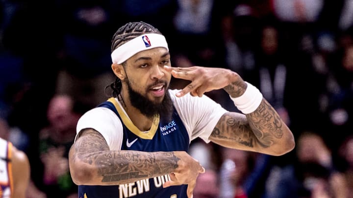 Dec 5, 2024; New Orleans, Louisiana, USA;  New Orleans Pelicans forward Brandon Ingram (14) reacts to making a three point basket against the Phoenix Suns during the first half  at Smoothie King Center. Mandatory Credit: Stephen Lew-Imagn Images