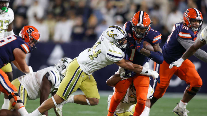 Nov 18, 2023; Atlanta, Georgia, USA; Georgia Tech Yellow Jackets linebacker Kyle Efford (44) tackles Syracuse Orange running back LeQuint Allen (1) in the first half at Bobby Dodd Stadium at Hyundai Field. Mandatory Credit: Brett Davis-USA TODAY Sports