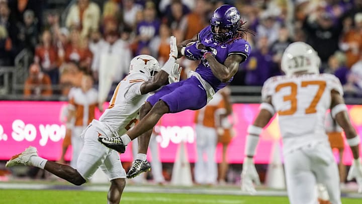 Green Bay Packers draft pick Savion Williams of TCU catches the ball between two Texas defenders. Green Bay Packers draft pick Savion Williams of TCU catches the ball between two Texas defenders.