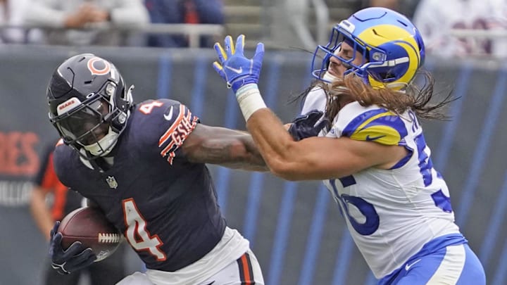 Sep 29, 2024; Chicago, Illinois, USA; Los Angeles Rams linebacker Christian Rozeboom (56) tries to tackle Chicago Bears running back D'Andre Swift (4) during the second half at Soldier Field. Mandatory Credit: David Banks-Imagn Images