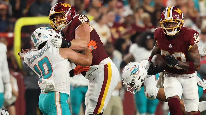 Aug. 14, 2026; Landover, Maryland, USA; Washington Commanders rookie offensive lineman Matt Gulbin leads the way as a blocker for running back Robert Henry Jr. (30) against the Miami Dolphins during preseason action at Northwest Stadium. Mandatory Credit: Geoff Burke-Imagn Images Aug. 14, 2026; Landover, Maryland, USA; Washington Commanders rookie offensive lineman Matt Gulbin leads the way as a blocker for running back Robert Henry Jr. (30) against the Miami Dolphins during preseason action at Northwest Stadium. Mandatory Credit: Geoff Burke-Imagn Images