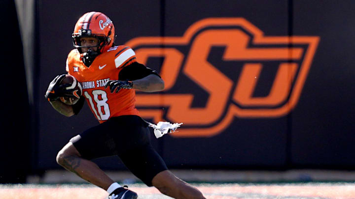 Oklahoma State's Sam Jackson V (18) rushes in the first half of the college football game between the Oklahoma State Cowboys and the Baylor Bears at Boone Pickens Stadium in Stillwater, Okla., Saturday, Sept. 27, 2025. Oklahoma State's Sam Jackson V (18) rushes in the first half of the college football game between the Oklahoma State Cowboys and the Baylor Bears at Boone Pickens Stadium in Stillwater, Okla., Saturday, Sept. 27, 2025.