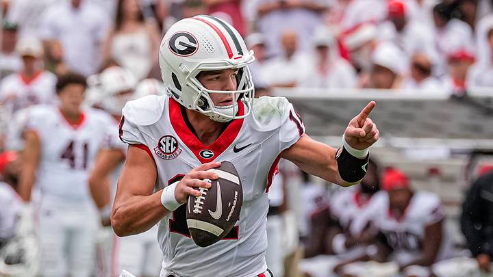 Sep 12, 2026; Athens, Georgia, USA; Georgia Bulldogs quarterback Gunner Stockton (14) rolls out and runs against the Western Kentucky Hilltoppers during the first half at Sanford Stadium. Mandatory Credit: Dale Zanine-Imagn Images Sep 12, 2026; Athens, Georgia, USA; Georgia Bulldogs quarterback Gunner Stockton (14) rolls out and runs against the Western Kentucky Hilltoppers during the first half at Sanford Stadium. Mandatory Credit: Dale Zanine-Imagn Images